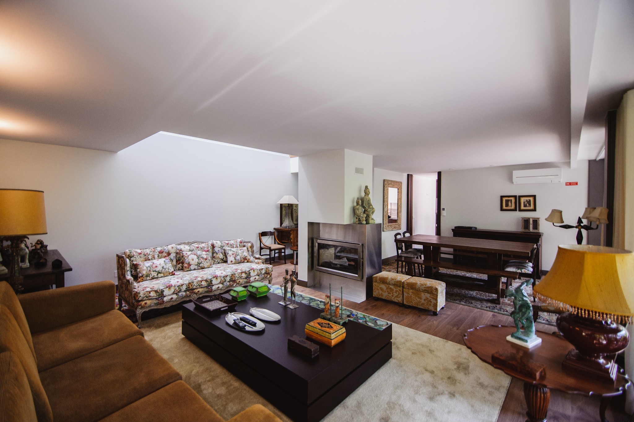 Interior living room with sofa, table, and fireplace