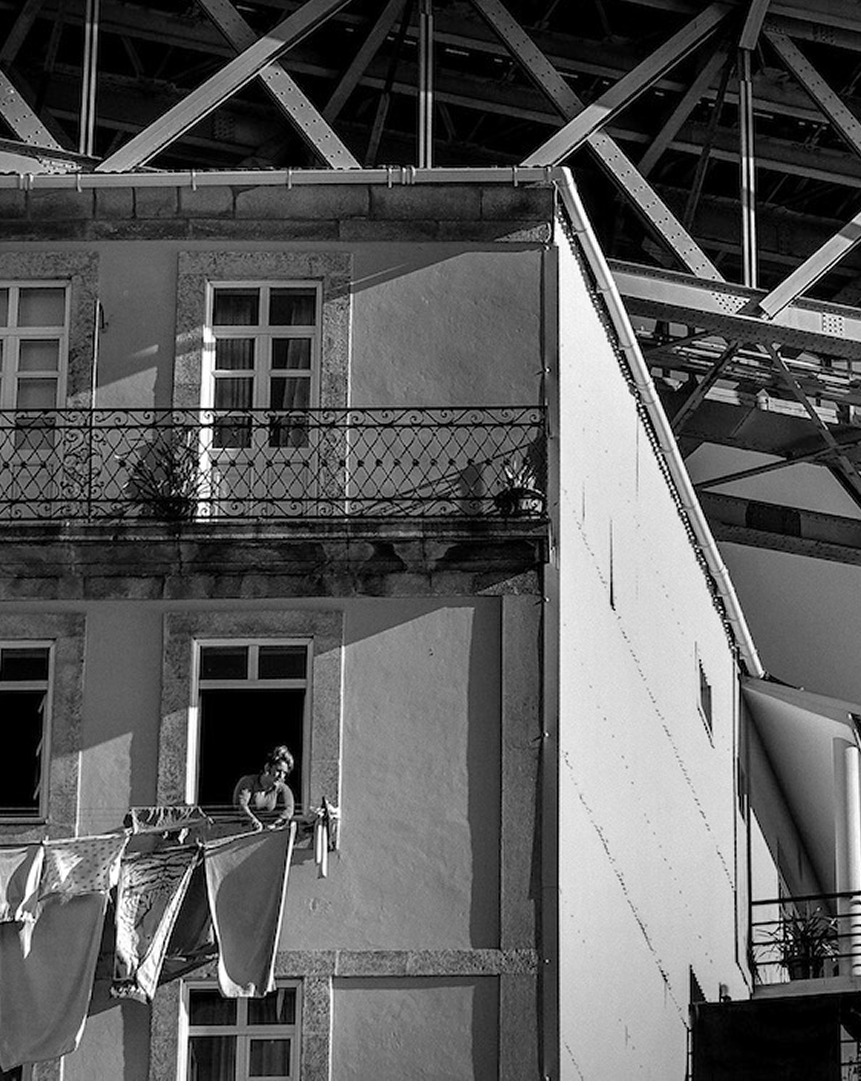 Black and white building façade with balconies and windows
